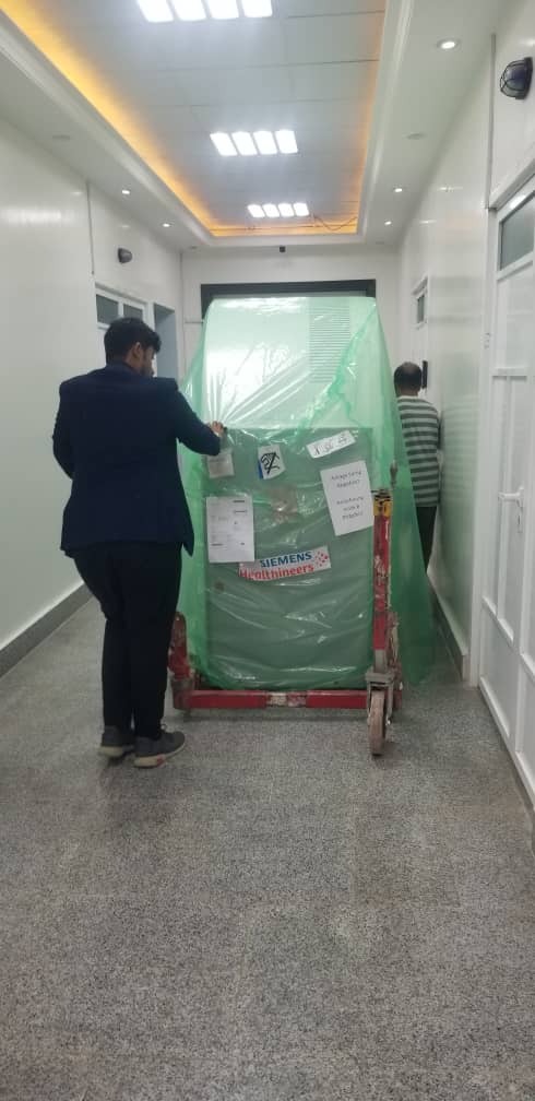 CT gantry moved through hospital corridor
